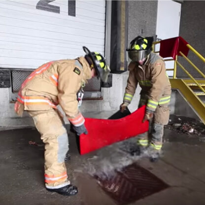 firefighters covering sewer grate