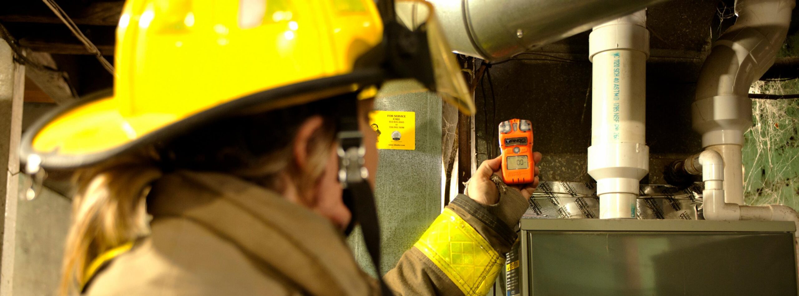firefighter with gas detector